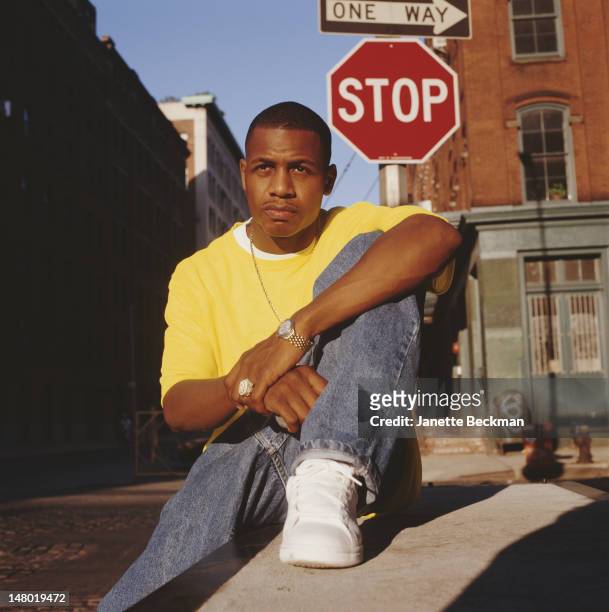 Portrait of American rapper AZ as he poses at an unspecified intersection in New York, New York, 1998.