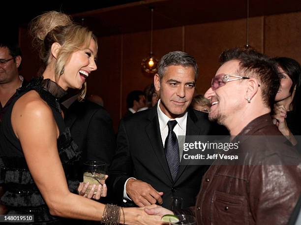 Actress Stacy Keibler, actor George Clooney and singer Bono of U2 attend the Fox Searchlight Pictures, Belvedere Vodka And Vanity Fair Celebration of...