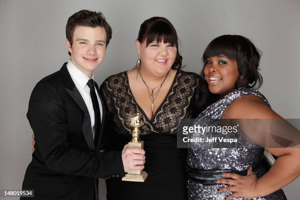 Actors Chris Colfer, Ashley Fink and Amber Riley pose with the award for Best Television Series for 'Glee' at the 68th Annual Golden Globe Awards...