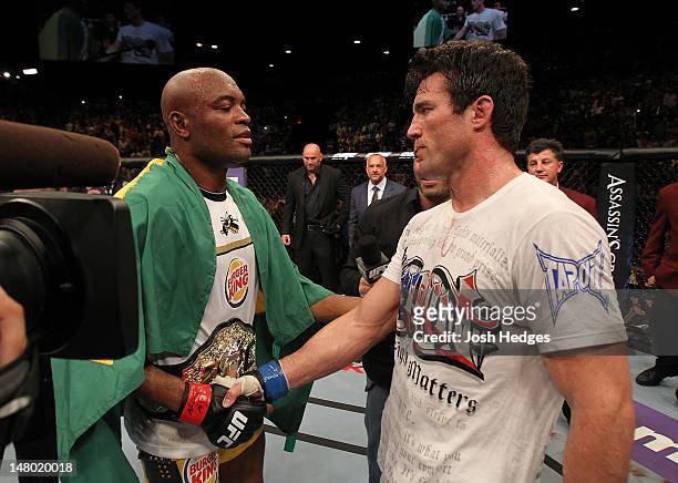 Anderson Silva and Chael Sonnen congratulate one another after their UFC middleweight championship bout at UFC 148 inside MGM Grand Garden Arena on...