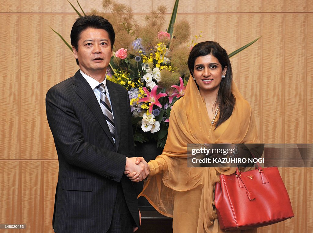 Hami Rabbani Pakistan's Foreign Minister Hina Rabbani Khar shakes hands with her ...