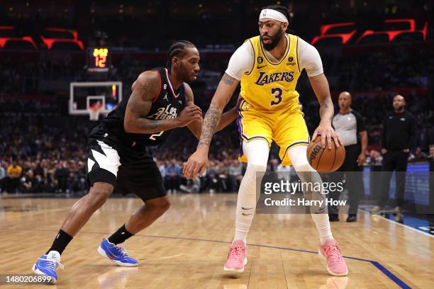 Anthony Davis of the Los Angeles Lakers keeps he dribble as he is guarded by Kawhi Leonard of the LA Clippers during the first half at Crypto.com...