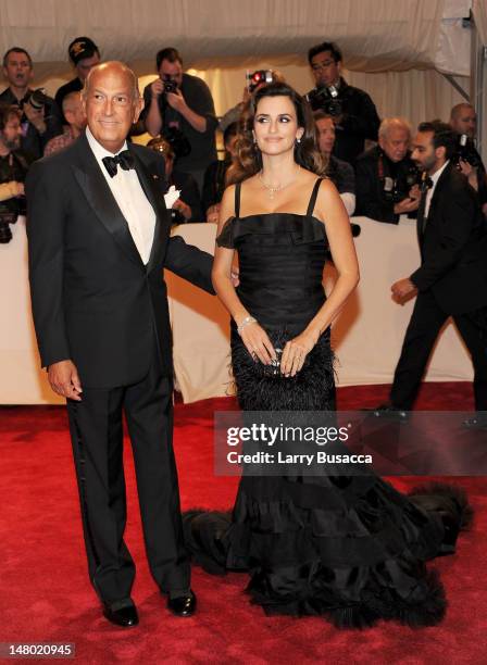 Designer Oscar de la Renta and actress Penelope Cruz attend the "Alexander McQueen: Savage Beauty" Costume Institute Gala at The Metropolitan Museum...