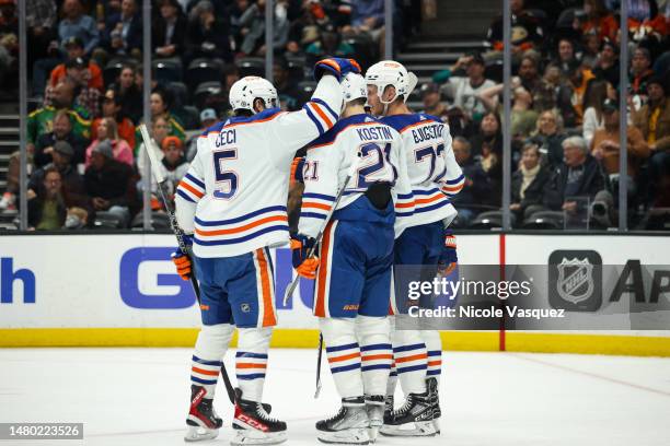 Nick Bjugstad of the Edmonton Oilers celebrates with teammates Klim Kostin and Cody Ceci after scoring a goal during the second period against the...