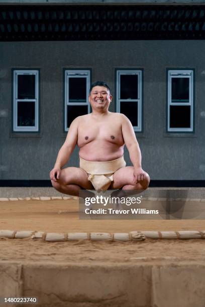 portrait of a mid-adult male sumo wrestling coach on a dohyo - men in loincloths stock pictures, royalty-free photos & images
