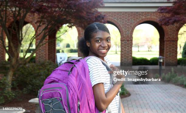 african american teenager posing with backpack. - virginia beach va stock pictures, royalty-free photos & images