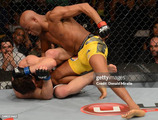 Anderson Silva punches Chael Sonnen during their UFC middleweight championship bout at UFC 148 inside MGM Grand Garden Arena on July 7, 2012 in Las...