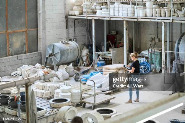 ceramic products manufacturing factory with a woman using digital tablet - gypsum stock pictures, royalty-free photos & images