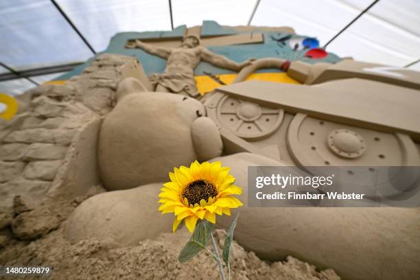 Preparing for the summer season opening this weekend, award-winning Ukrainian Sand Sculptor Slava Borecki's Ukrainian sand sculpture, sculpted at the...