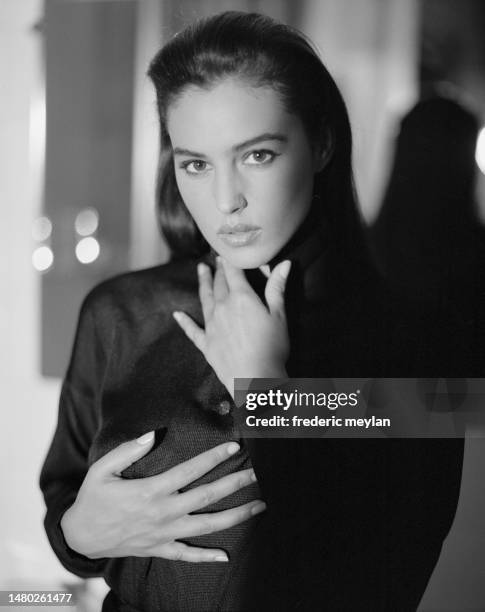 Italian actress and model Monica Bellucci wears a black outfit designed by Angelo Tarlazzi.