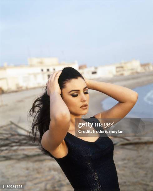 Italian Actress and Model Monica Bellucci on a beach in Italy.