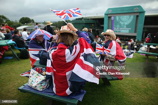 Tennis fans gather on 'Murray Mount,' to watch the final day at Wimbledon, on July 8, 2012 in London, England. Andy Murray is the first British man...