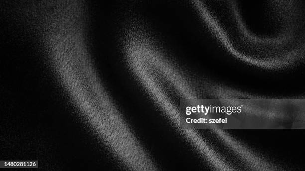 smooth elegant black polyester textile texture fabric background. close up. - satin stock pictures, royalty-free photos & images