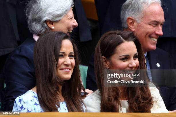 Pippa Middleton and Catherine, Duchess of Cambridge sit in the Royal Box during the Gentlemen's Singles final match between Roger Federer of...