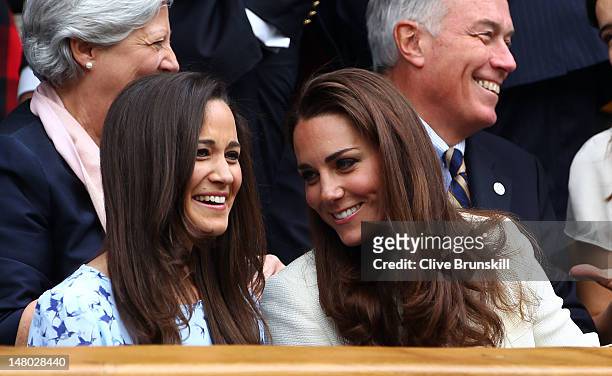 Pippa Middleton and Catherine, Duchess of Cambridge sit in the Royal Box during the Gentlemen's Singles final match between Roger Federer of...