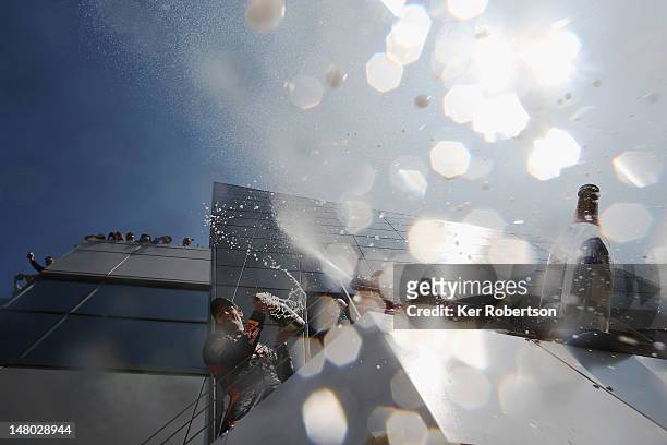 Mark Webber of Australia and Red Bull Racing celebrates on the podium after winning the British Grand Prix at Silverstone Circuit on July 8, 2012 in...