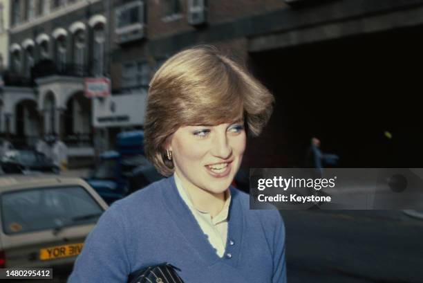 Lady Diana Spencer wearing a blue sweater over a white blouse, possibly outside her home in Coleherne Court, London, England, January 1981.