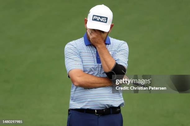 Louis Oosthuizen of South Africa reacts to a missed putt on the second green during the first round of the 2023 Masters Tournament at Augusta...