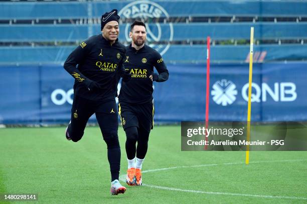 Kylian Mbappe and Leo Messi warmup during a Paris Saint-Germain training session on April 06, 2023 in Paris, France.