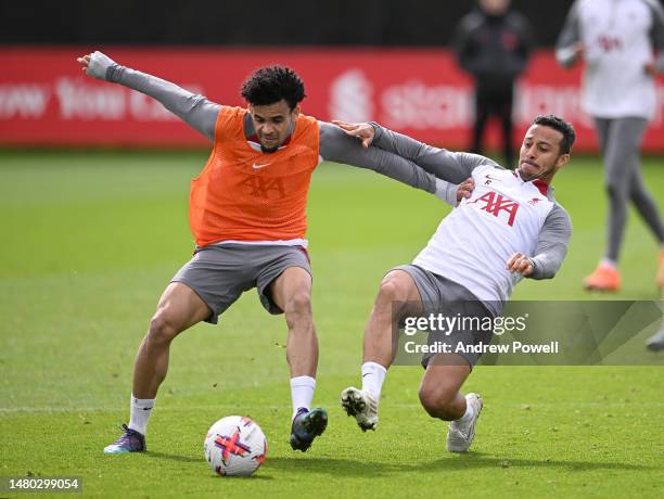 Luis Diaz competing with Thiago Alcantara of Liverpool during a training session at AXA Training Centre on April 06, 2023 in Kirkby, England.