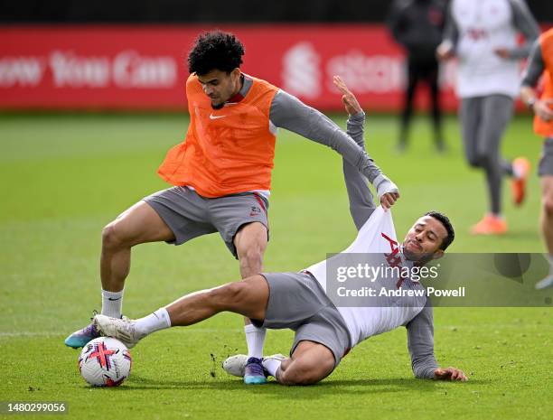 Luis Diaz competing with Thiago Alcantara of Liverpool during a training session at AXA Training Centre on April 06, 2023 in Kirkby, England.