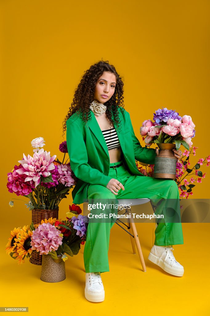 Beautiful woman among flowers