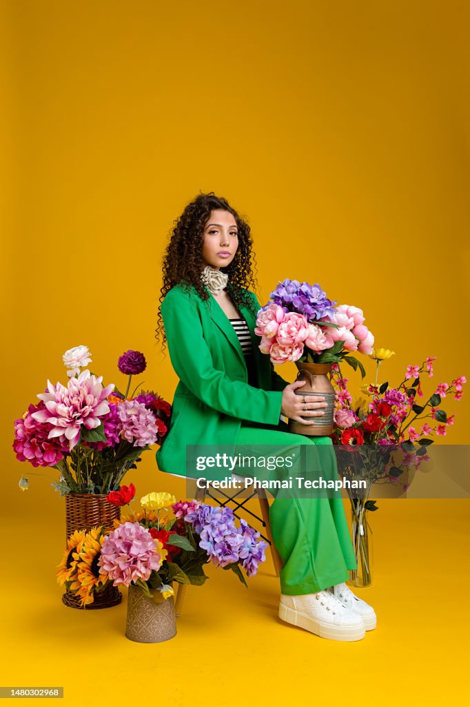 Beautiful woman among flowers