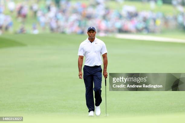Tiger Woods of the United States walks up the first fairway during the first round of the 2023 Masters Tournament at Augusta National Golf Club on...