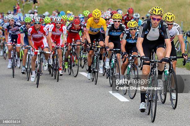 Christian Knees of Germany leads the peloton for Sky Procycling as they defend the race leader's yellow jersey for Bradley Wiggins of Great Britain...