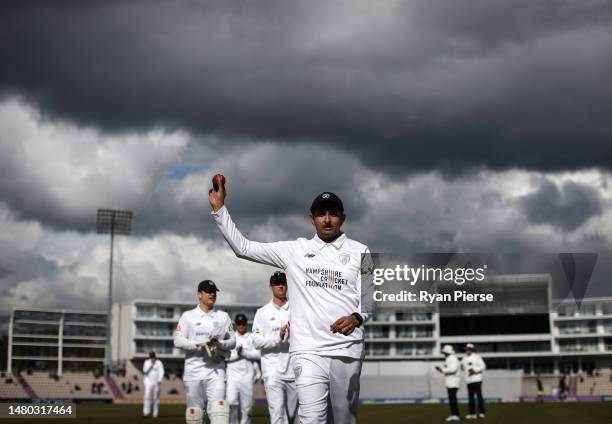 Mohammad Abbas of Hampshire raises the ball aloft as he leaves the field after claiming 6 wickets for 49 runs during day one of the LV= Insurance...