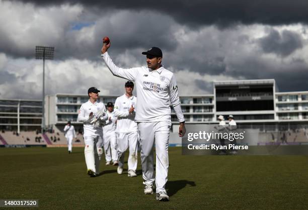 Mohammad Abbas of Hampshire raises the ball aloft as he leaves the field after claiming 6 wickets for 49 runs during day one of the LV= Insurance...