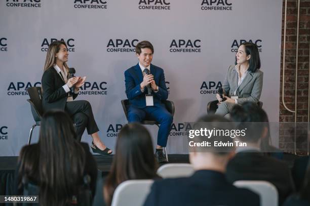 panel discussion asian business person  discussion on stage during business conference seminar - microphone debate stock pictures, royalty-free photos & images