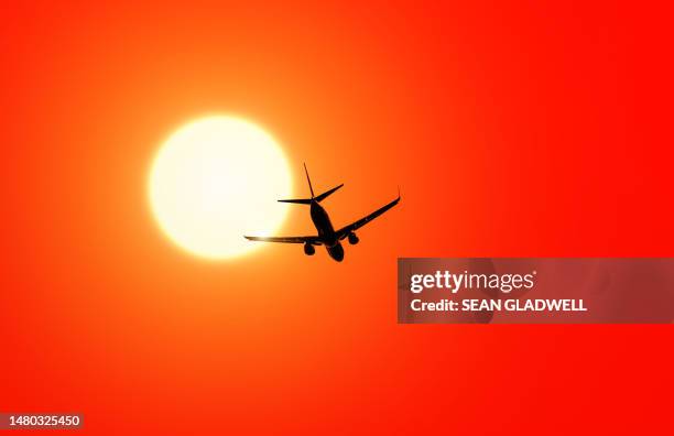 aircraft silhouette and sun - launch stock pictures, royalty-free photos & images