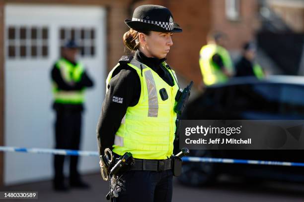 Police remain outside the home of former Scottish First Minister Nicola Sturgeon and her husband Peter Murrell on April 06, 2023 in Glasgow,...