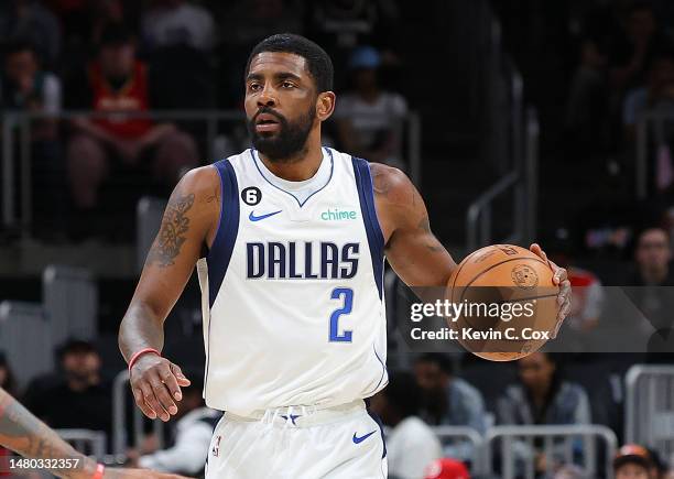 Kyrie Irving of the Dallas Mavericks drives against the Atlanta Hawks during the first quarter at State Farm Arena on April 02, 2023 in Atlanta,...