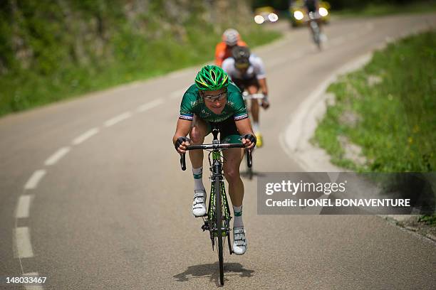 France's Thomas Voeckler speeds in the 157,5 km and eighth stage of the 2012 Tour de France cycling race starting in Belfort and finishing in...