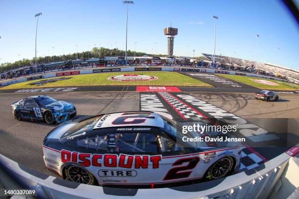 Austin Cindric, driver of the Discount Tire Ford, crosses the start /finish line during the NASCAR Cup Series Toyota Owners 400 at Richmond Raceway...