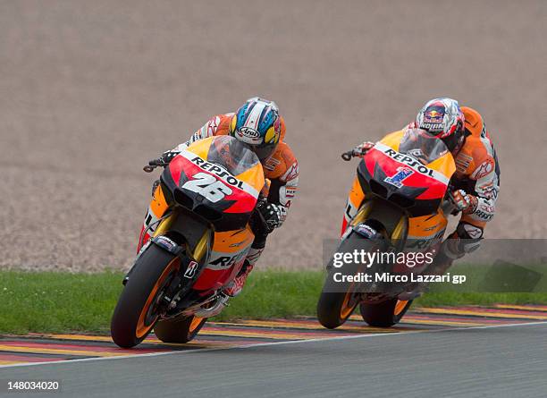 Dani Pedrosa of Spain and Repsol Honda Team leads Casey Stoner of Australia and Repsol Honda Team during the MotoGP race of the MotoGp of Germany at...