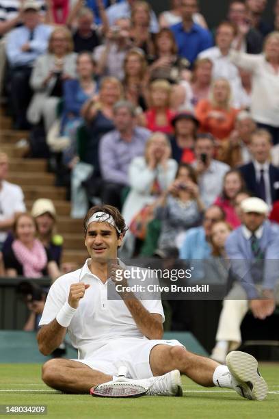 Roger Federer of Switzerland celebrates match point during his Gentlemen's Singles final match against Andy Murray of Great Britain on day thirteen...