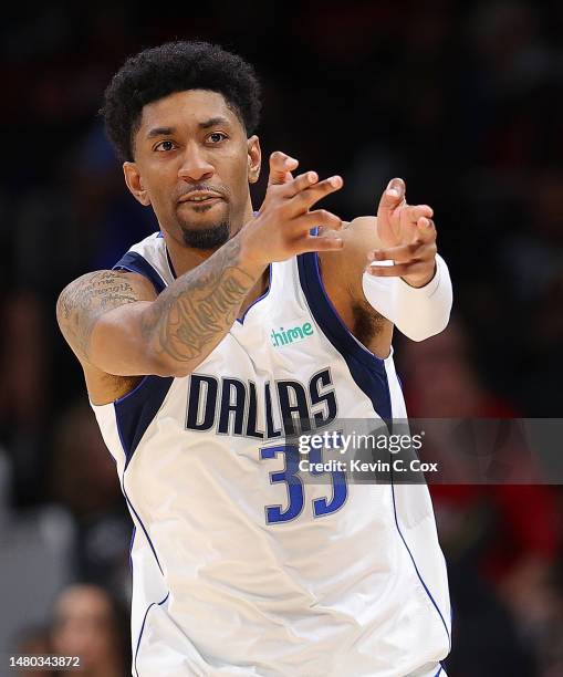 Christian Wood of the Dallas Mavericks drives against the Atlanta Hawks during overtime at State Farm Arena on April 02, 2023 in Atlanta, Georgia....