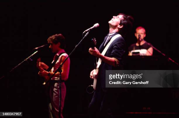 American Rock and Pop musician Jackson Browne plays electric guitar as he performs, with his band, during the 'Lawyers in Love' tour at Madison...
