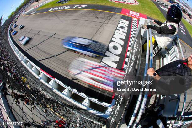 Cars cross the start/finish line during the NASCAR Cup Series Toyota Owners 400 at Richmond Raceway on April 02, 2023 in Richmond, Virginia.