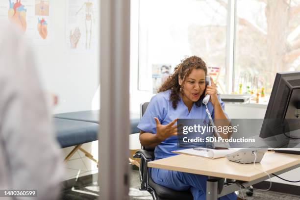 Nurse Ringing Computer Scrubs On Desktop Computer And Phone Photos and Premium High Res ...