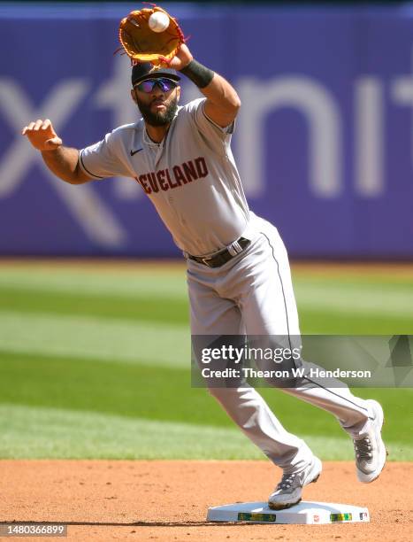 Amed Rosario of the Cleveland Guardians takes the throw at second base for an out against the Oakland Athletics in the bottom of the first inning at...