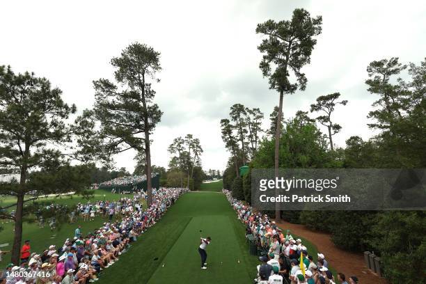 Tiger Woods of the United States plays his shot from the 18th tee during the first round of the 2023 Masters Tournament at Augusta National Golf Club...