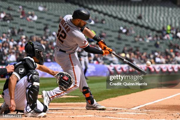 David Villar of the San Francisco Giants hits a double in the first inning against the Chicago White Sox at Guaranteed Rate Field on April 06, 2023...