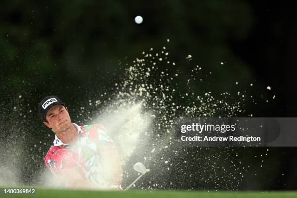 Viktor Hovland of Norway plays a shot from a bunker on the 18th hole during the first round of the 2023 Masters Tournament at Augusta National Golf...