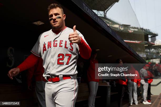 Mike Trout of the Los Angeles Angels gestures toward a fan during the first inning against the Seattle Mariners at T-Mobile Park on April 05, 2023 in...