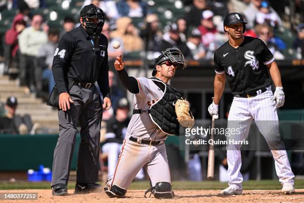 Blake Sabol of the San Francisco Giants throws to first base in front of Seby Zavala of the Chicago White Sox in the fifth inning at Guaranteed Rate...
