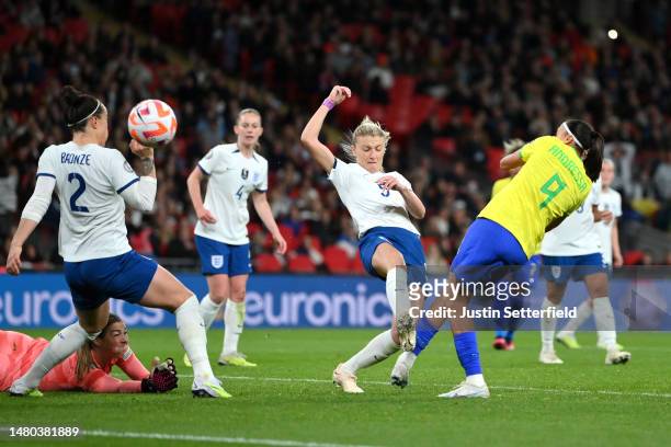 Andressa Alves of Brazil scores the team's first goal whilst under pressure from Leah Williamson of England during the Women´s Finalissima 2023 match...